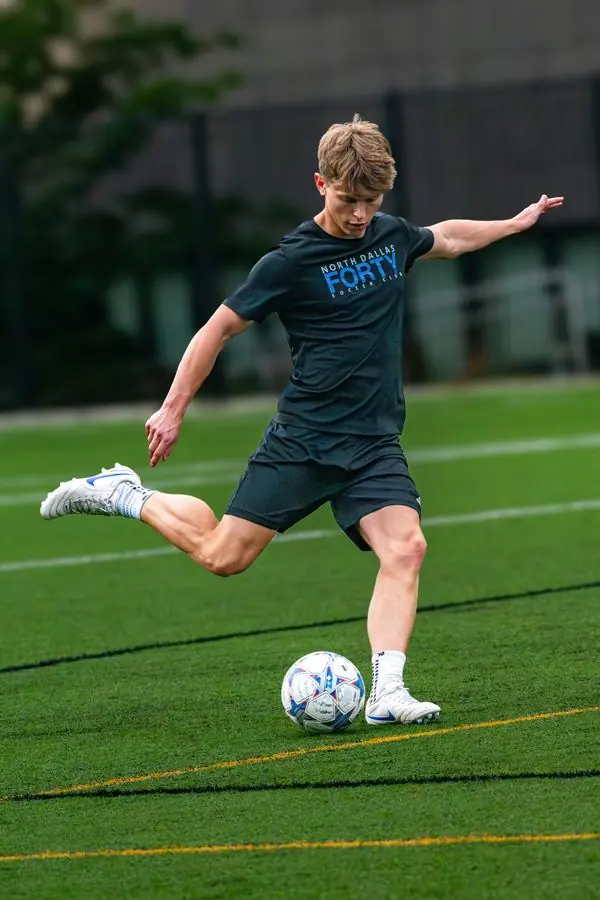 Soccer player striking the ball