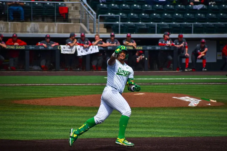 Oregon baseball player celebrating a home run