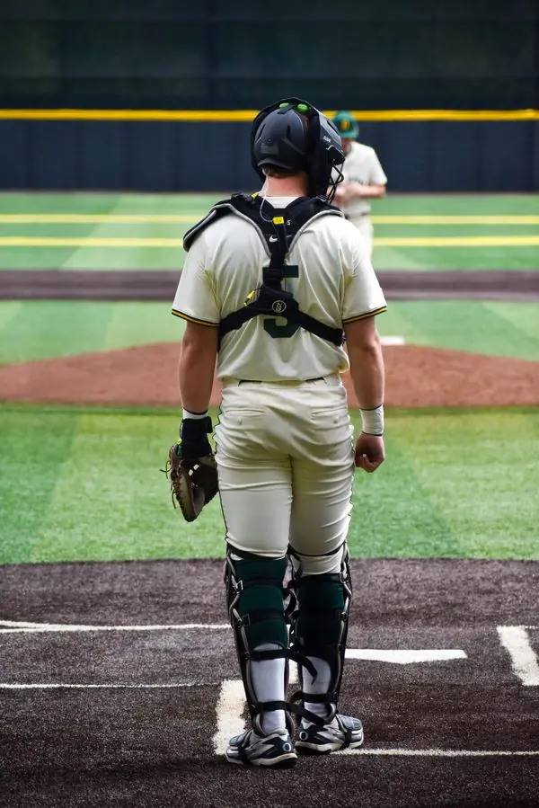 Oregon baseball catcher walking to home plate