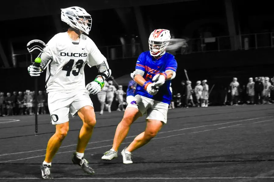 Oregon Ducks lacrosse player defending, No. 43