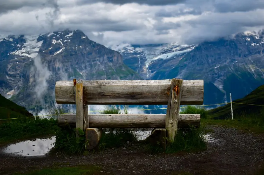 Wooden bench overlooking a glacier valley, Switzerland