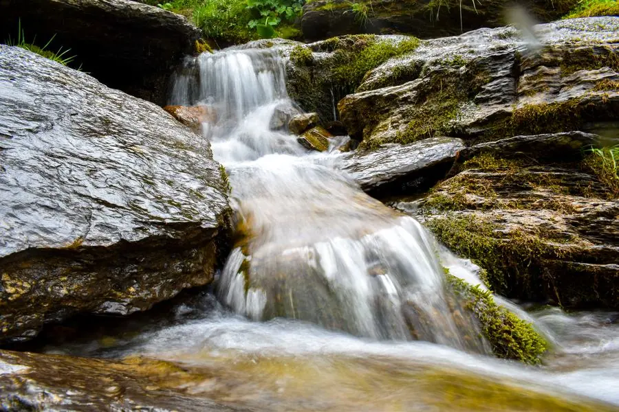 Waterfall cascading over mossy rocks