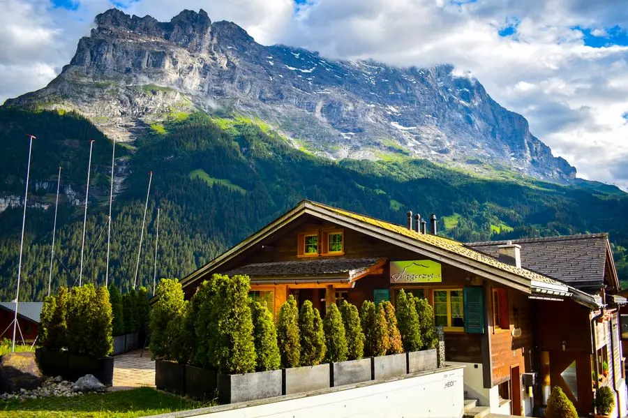 Alpine chalet beneath a mountain peak, Grindelwald, Switzerland