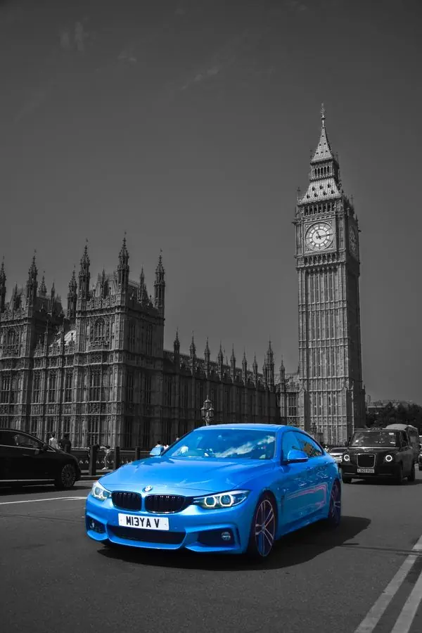 Blue car in front of Big Ben, London
