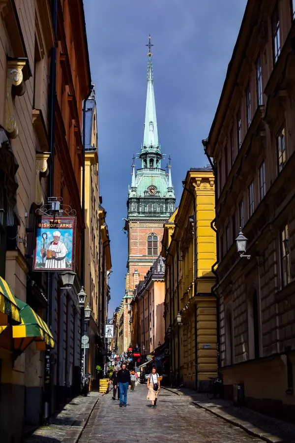 Narrow alley leading to a church spire, Stockholm
