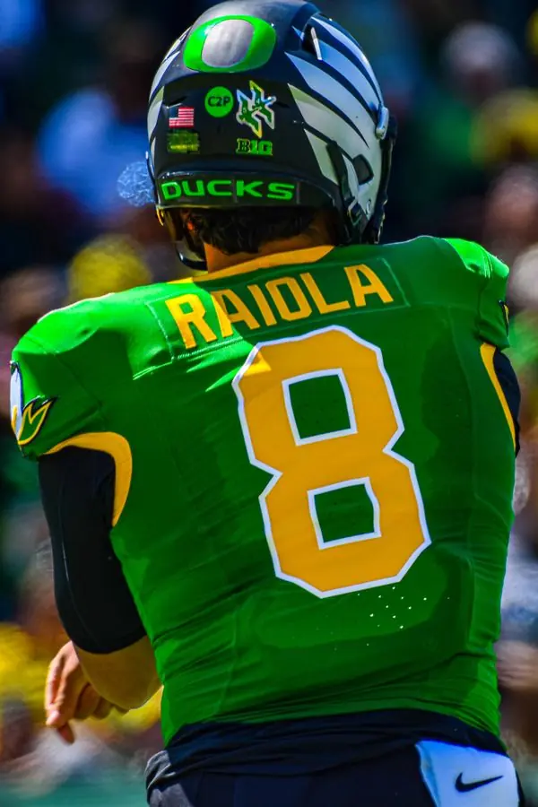 Football player number eight seen from behind