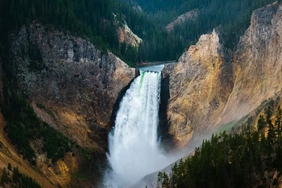Waterfall dropping through a rocky canyon