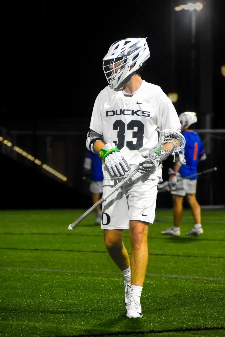Oregon Ducks lacrosse player walking off the field