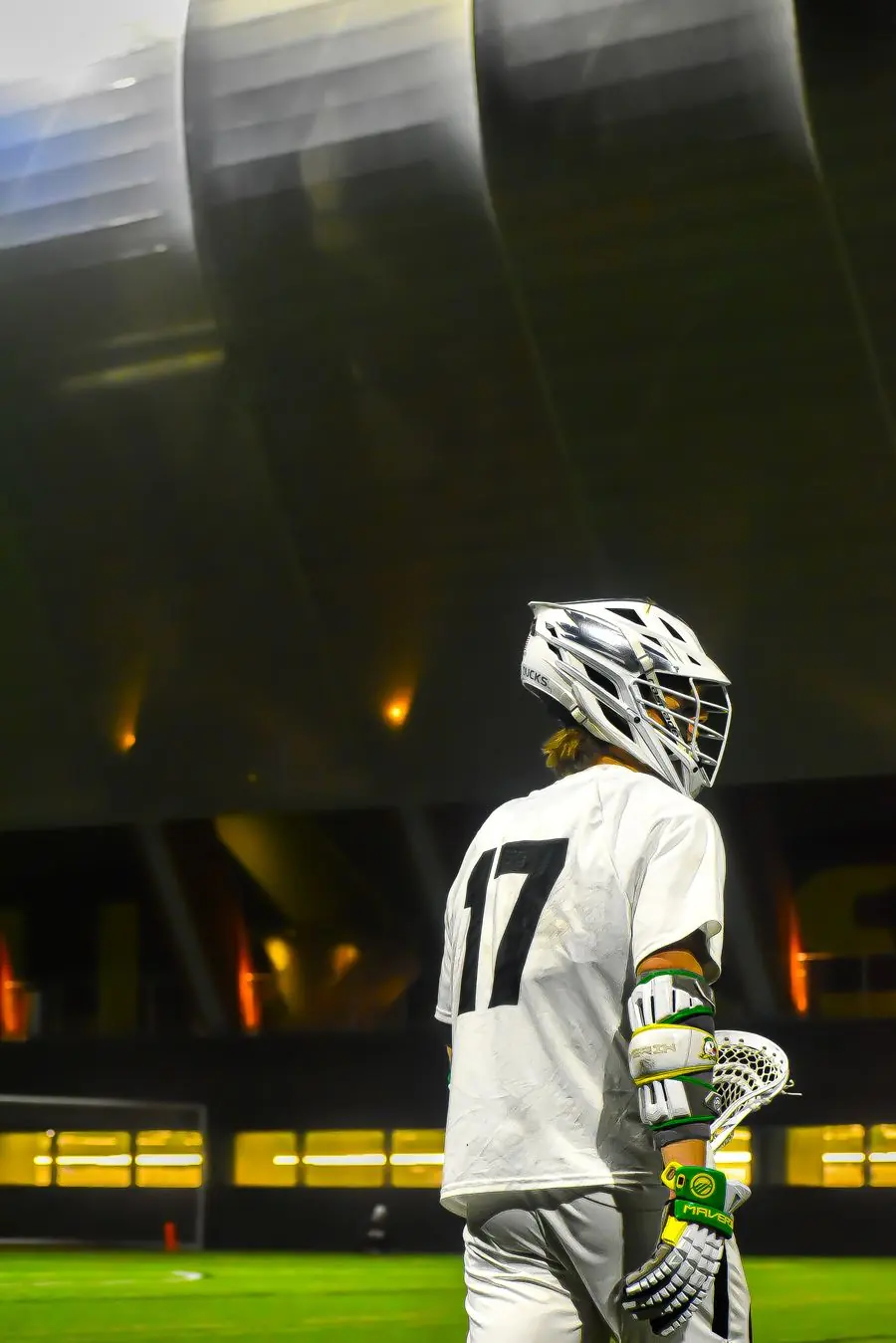Oregon Ducks lacrosse player under the stadium lights
