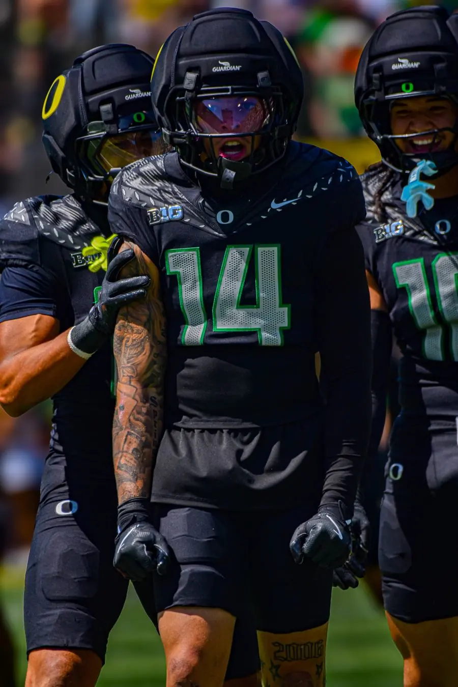 Oregon Ducks football player in black uniform