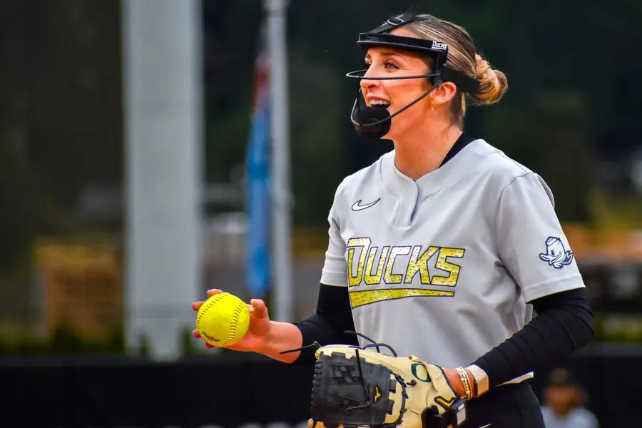 Oregon Ducks softball pitcher smiling with the ball