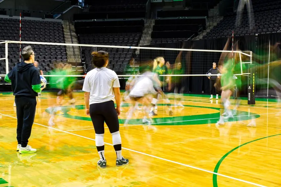 Oregon volleyball long exposure of players in motion