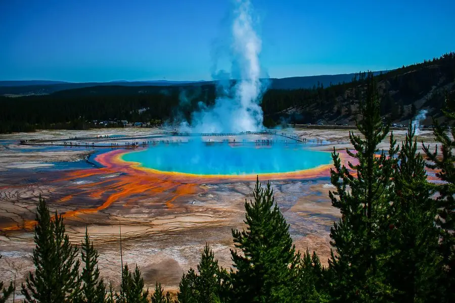 Grand Prismatic Spring erupting in geyser steam, Yellowstone