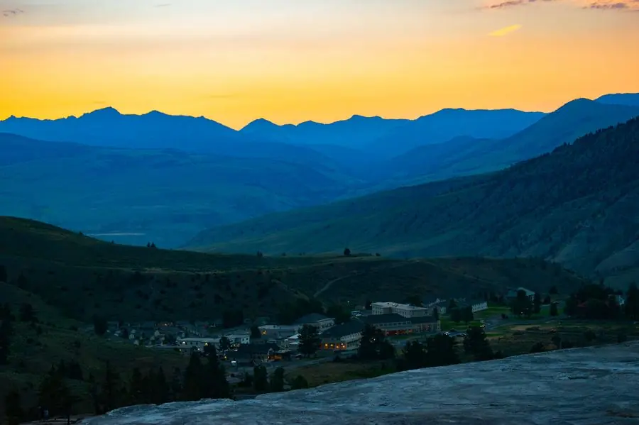 Sunset over Mammoth Hot Springs village and the mountains
